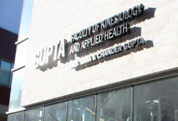 The Gupta Faculty of Kinesiology and Applied Health sign - photo credit: Megan Benedictson