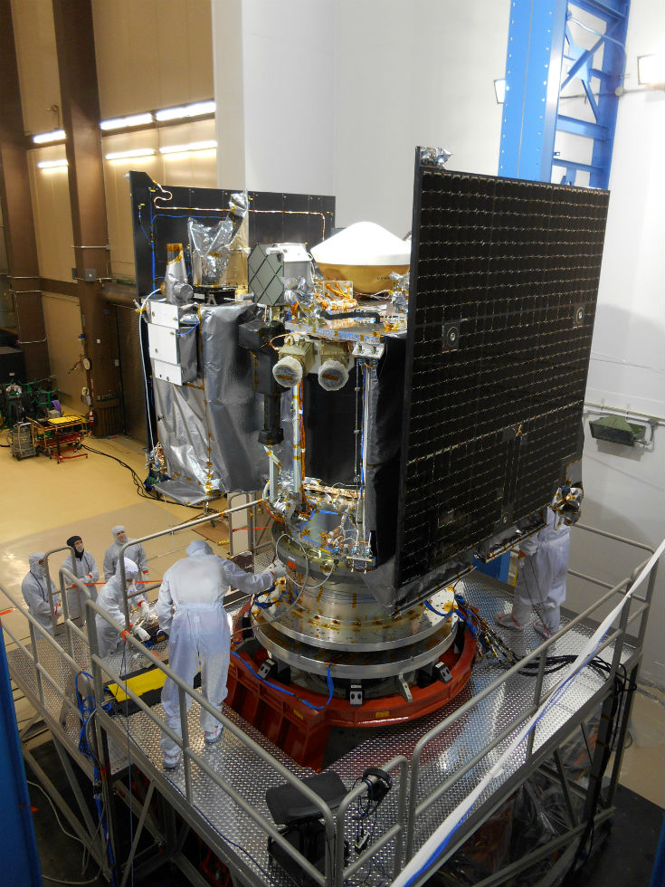 The OSIRIS-REx spacecraft sits on a fixture to undergo further testing at the Lockheed Martin facility – photo by Lockheed Martin Corporation
