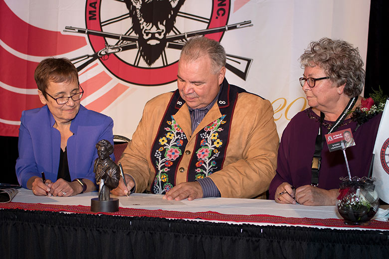 UWinnipeg President and Vice-Chancellor Dr. Annette Trimbee, MMF President David Chartrand, and MMF Provincial Education Minister Joan Ledoux at the agreement signing on September 23.