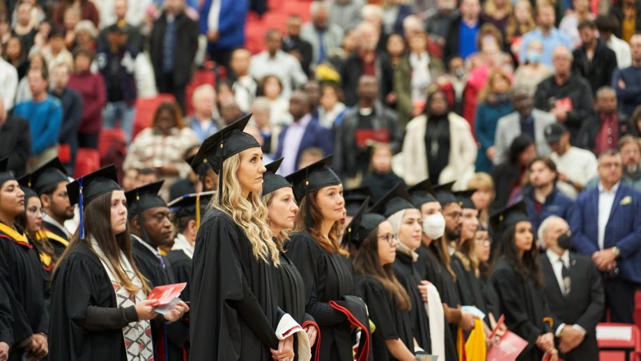Graduates standing in a row at Convocation