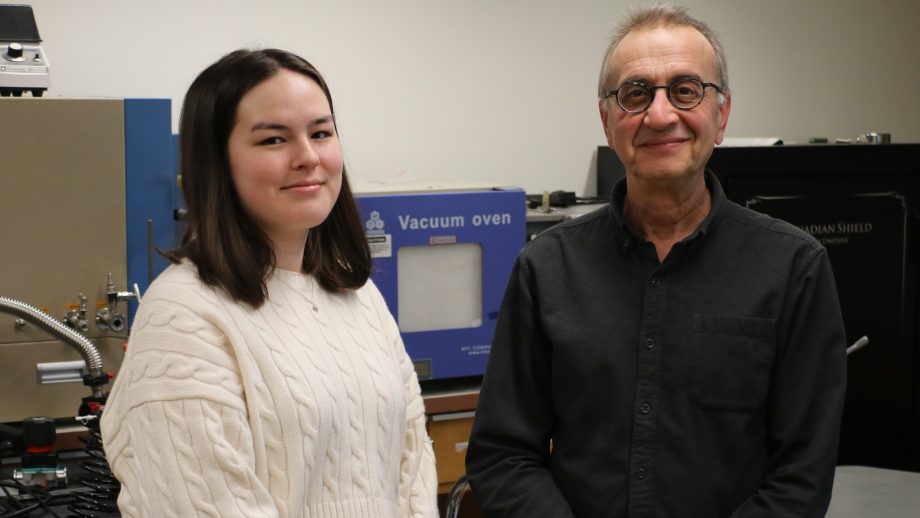 Tegan Ledoux and Dr. Ed Cloutis standing in his research lab.