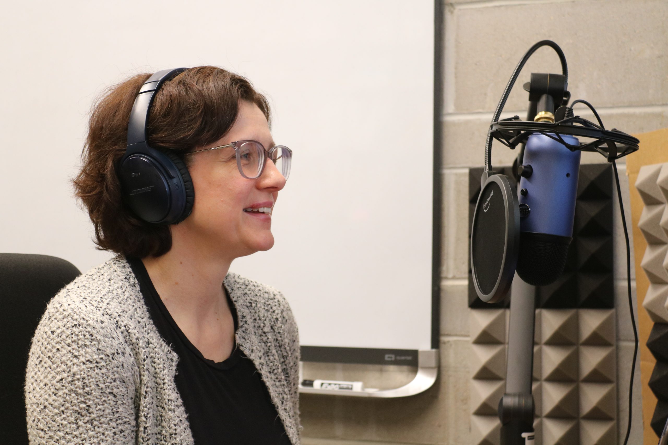 Dr. Anna Stokke recording a podcast