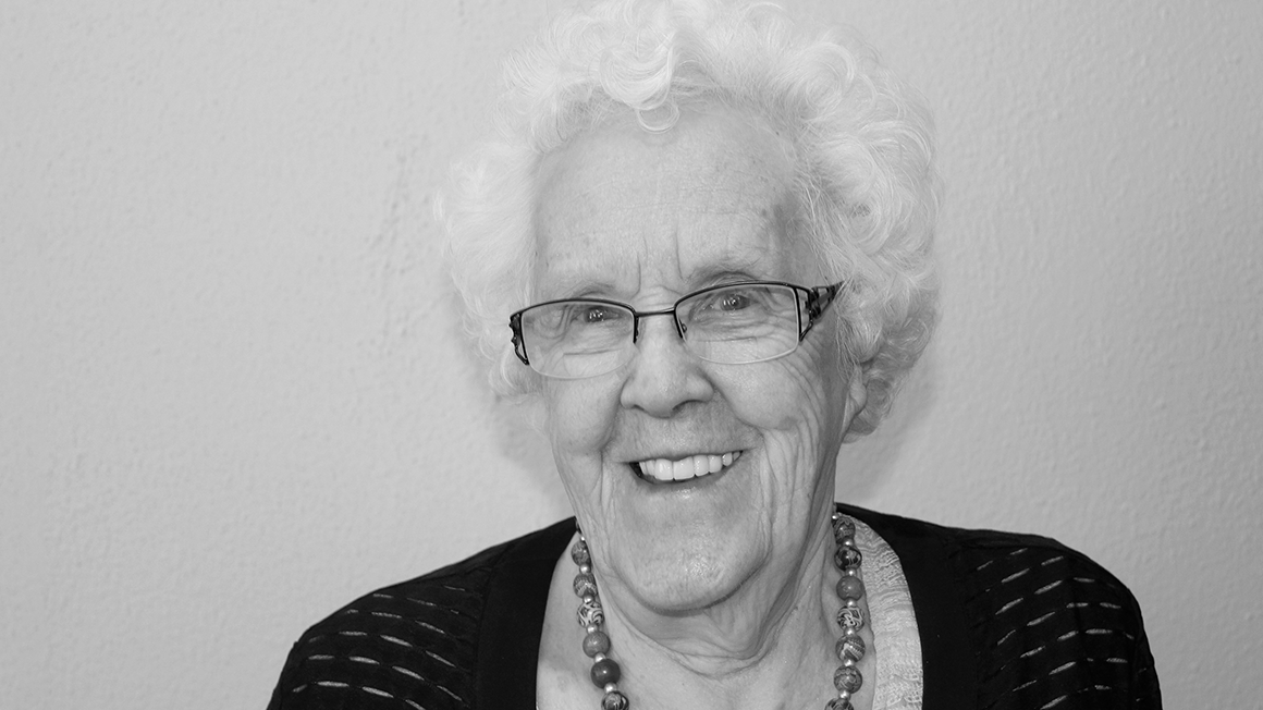 Black and white headshot photo of Margaret McPherson smiling.