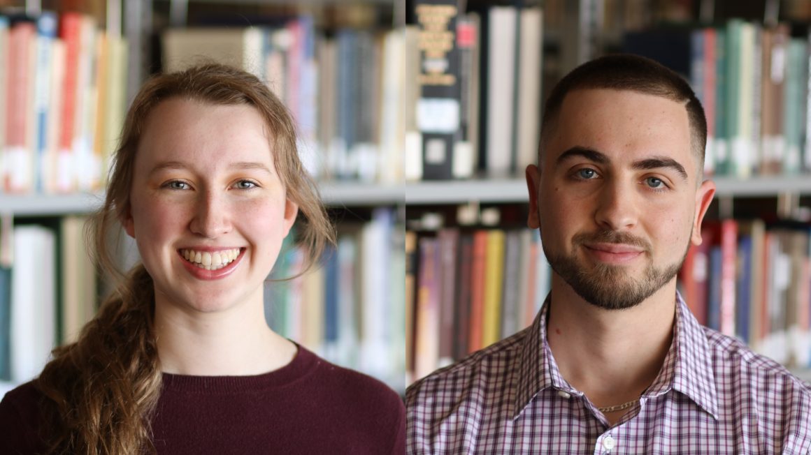 Adrianna Strempler and Tim Rozovsky are standing in front of book shelving in the library.