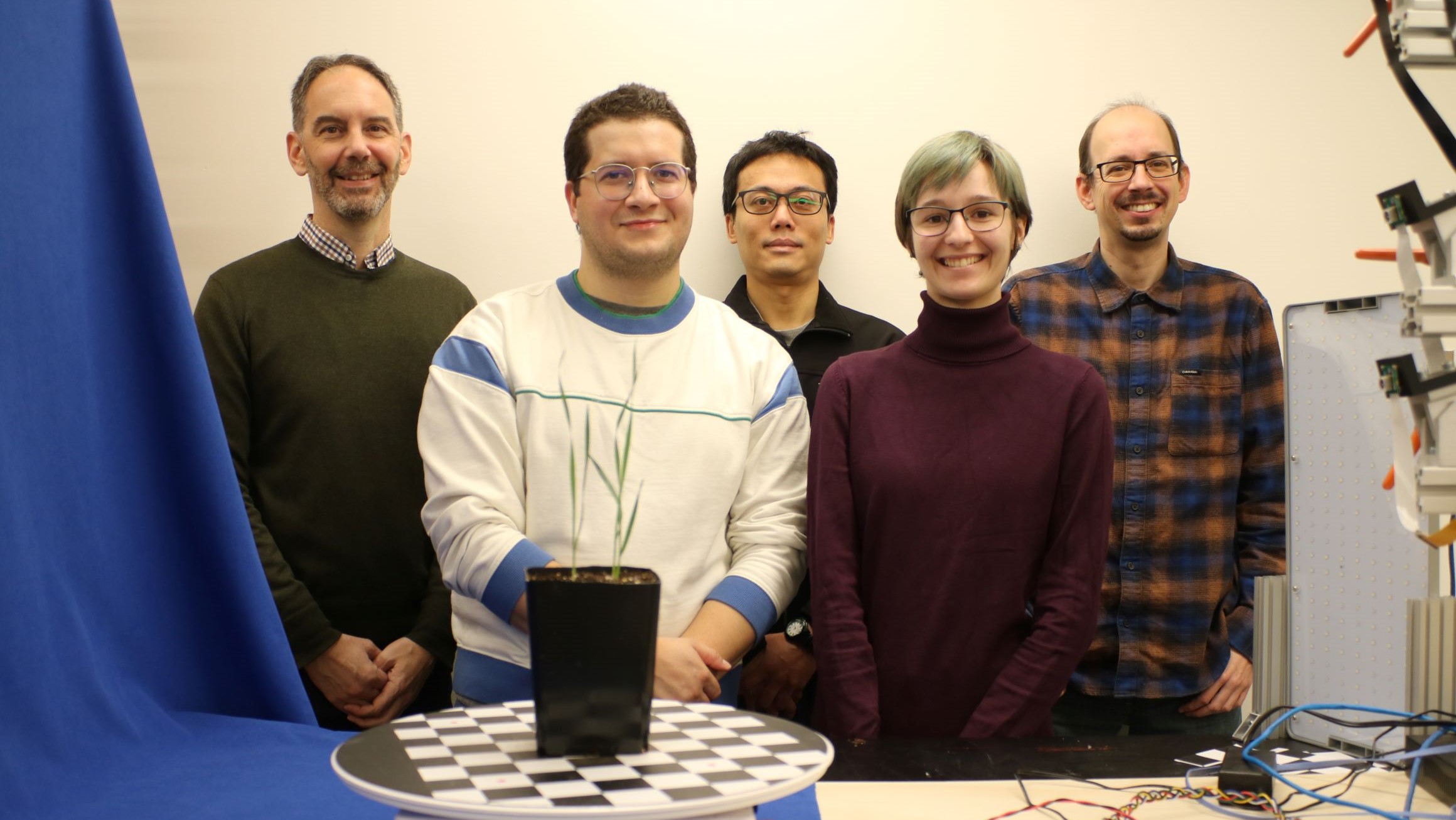 Dr. Christopher Bidinosti, Joe Hrzich, Chen-Yi Liu, Laura Didyk, and Dr. Michael Beck pose for a photo together in the TerraByte research lab.