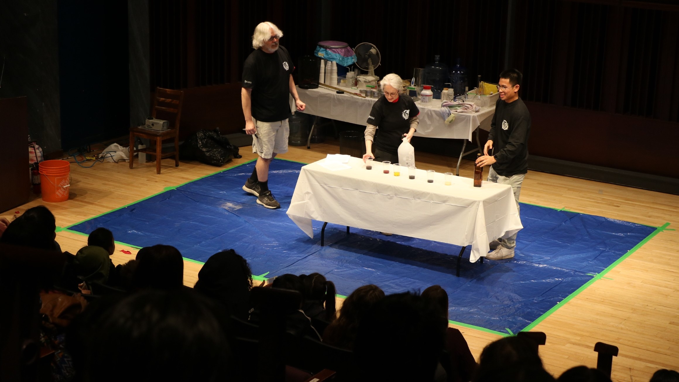 Three chemists perform fun experiments for a crowd of schoolchildren during last year's STEM Days.