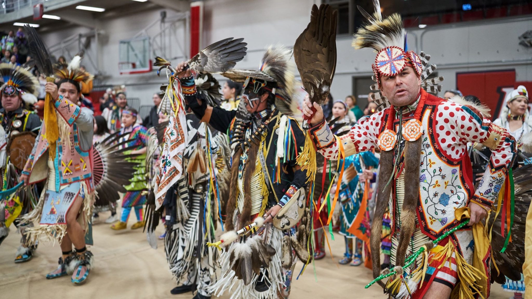 Honouring Indigenous grads and Red Dress Day at 2024 Graduation Pow Wow