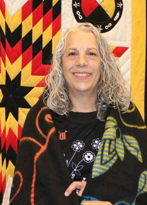 Holly Plouffe in front of Star blanket