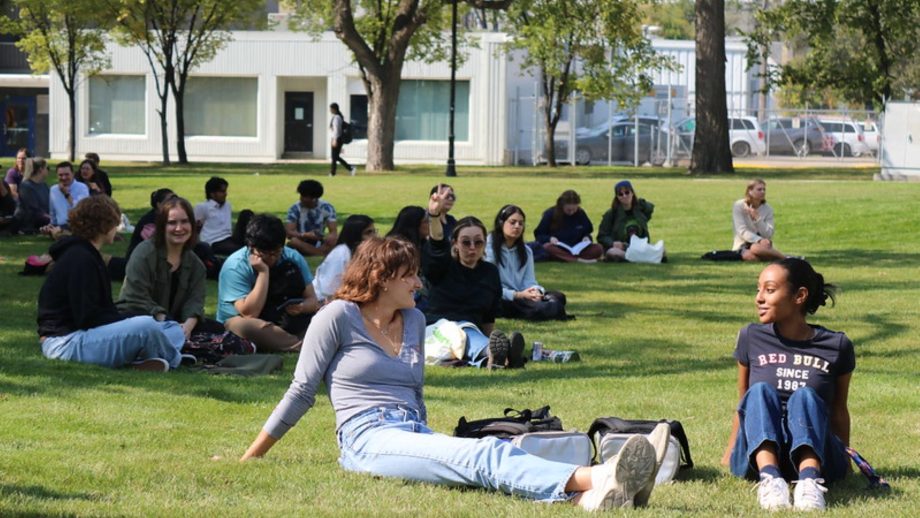 Students relax on the campus lawn