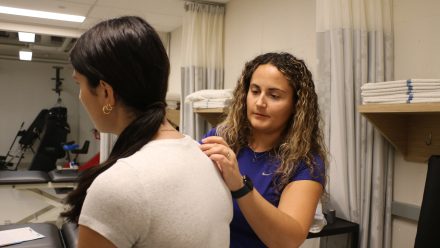 person standing while treating client