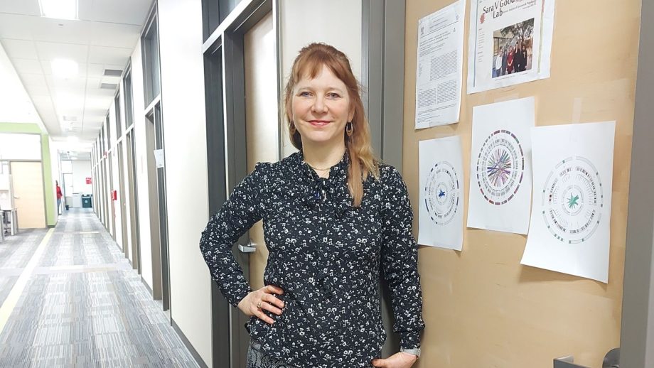 Dr. Sara Good standing in a hallway