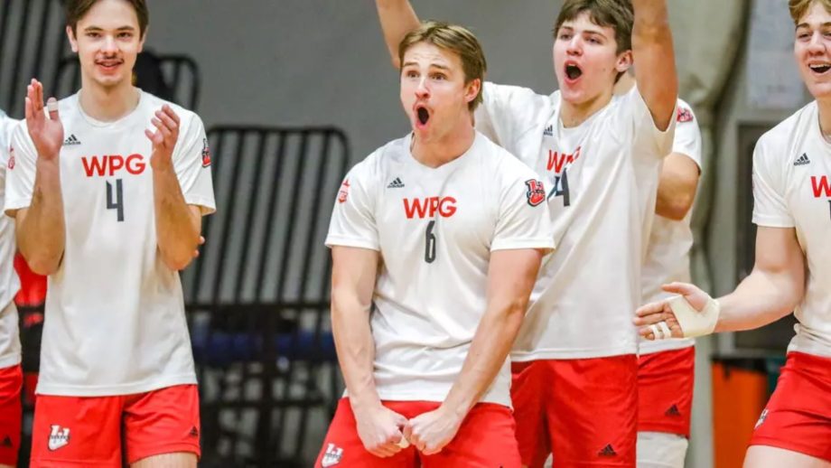 Wesmen men's volleyball team members celebrate on the court.