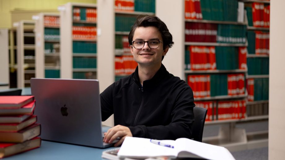 Thomas Hepworth sitting at a table in the library.