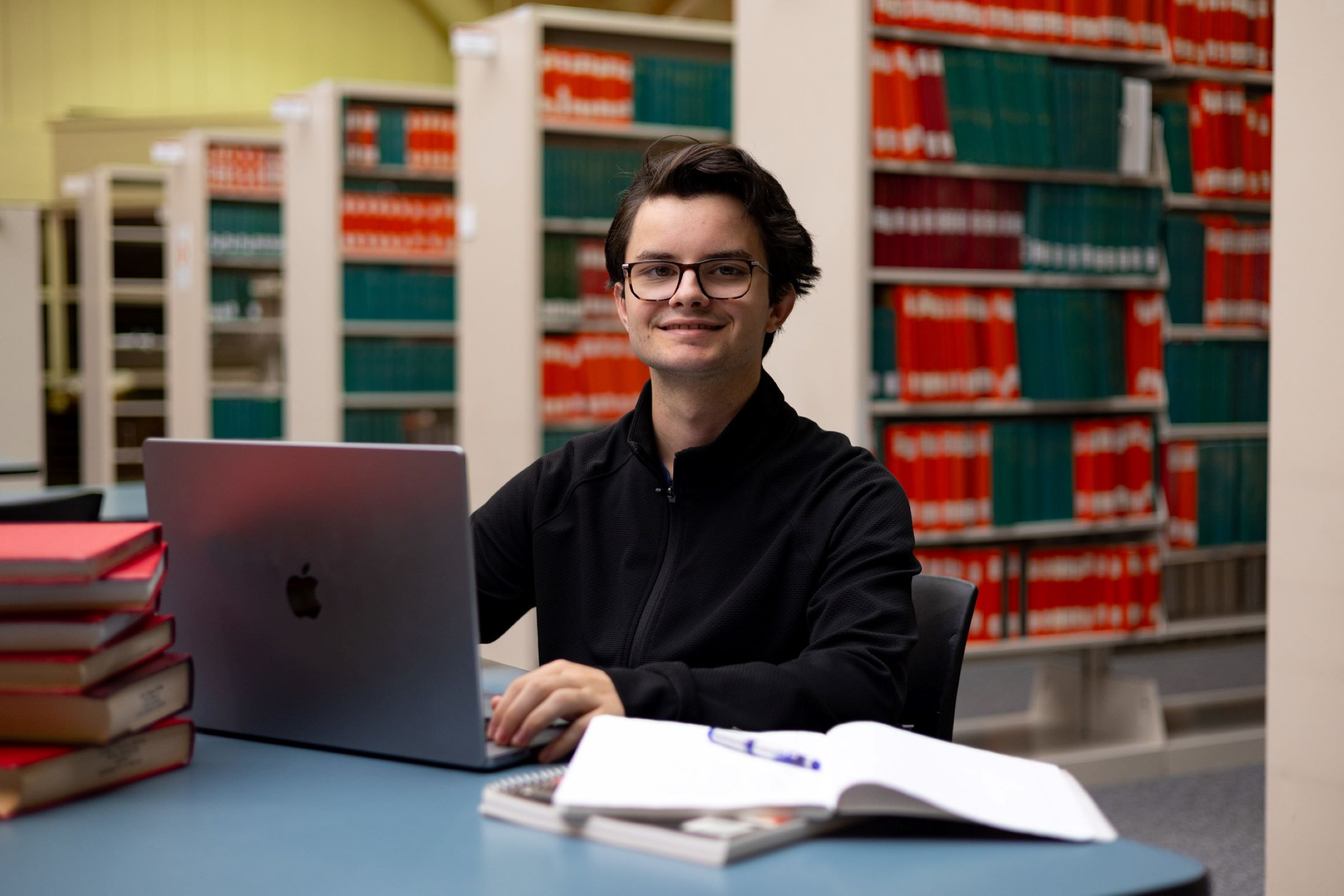 Thomas Hepworth sitting at a table in the library.