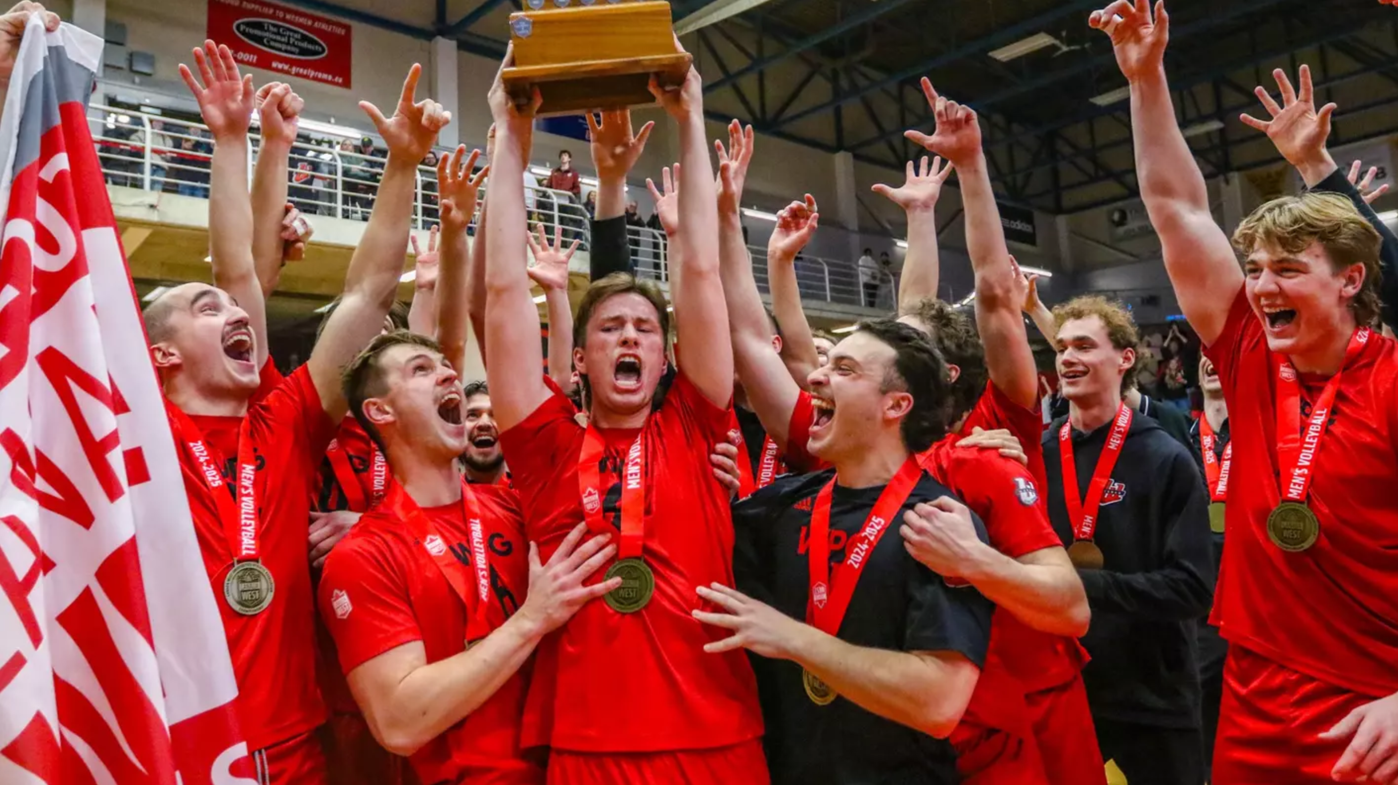 The Wesmen celebrate winning the Canada West championship.