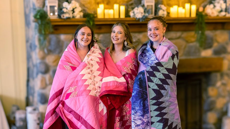Three people wrapped in star blankets