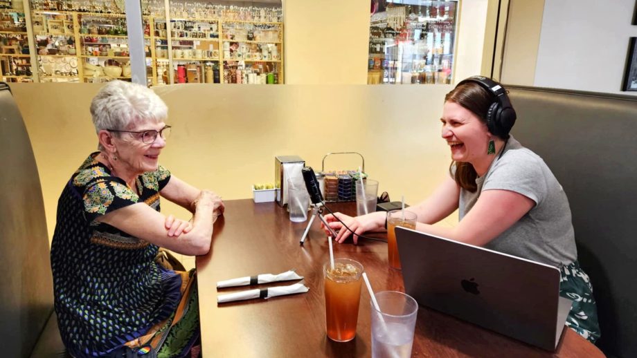 two people sit at a diner table