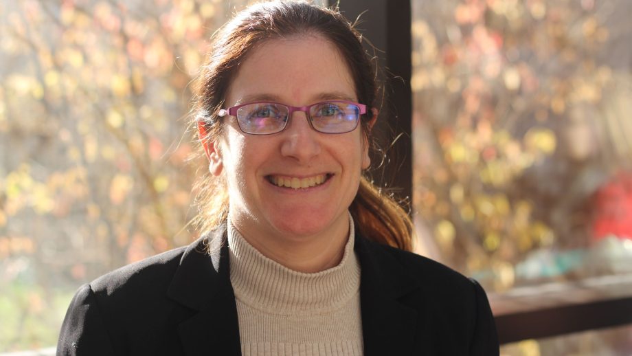Dr. Melanie Martin in front of a window.