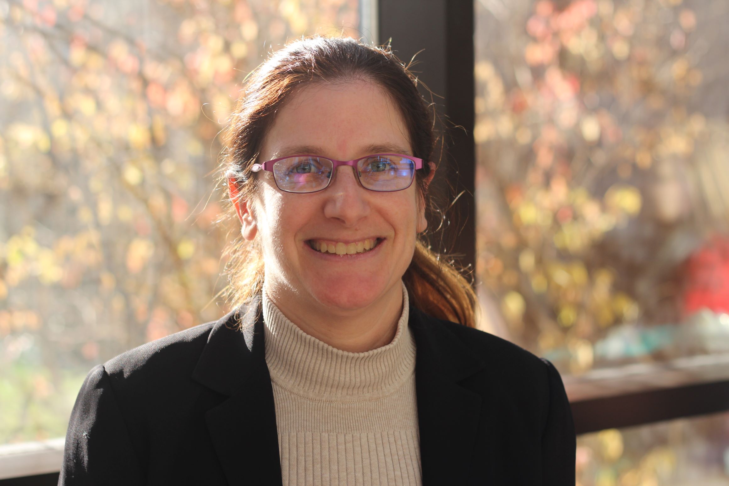 Dr. Melanie Martin in front of a window.