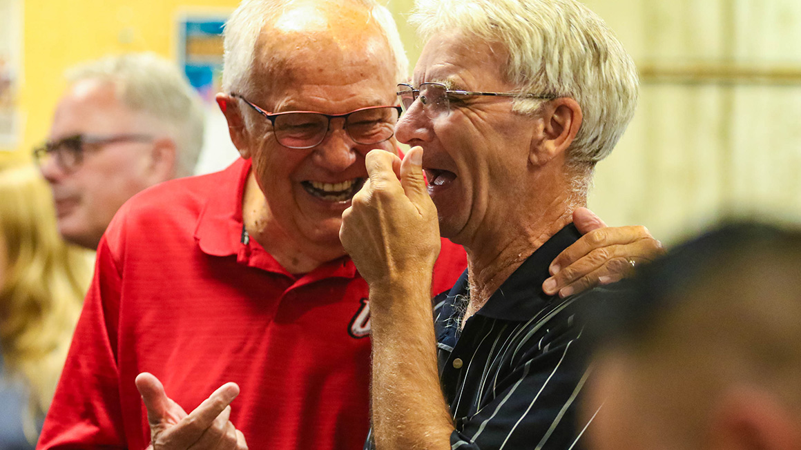 Two men laughing