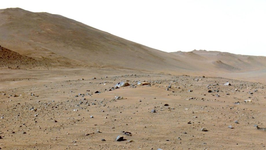 The rocky, desert-like landscape of Mars as captured by a rover's navigation camera.