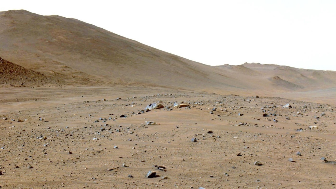 The rocky, desert-like landscape of Mars as captured by a rover's navigation camera.