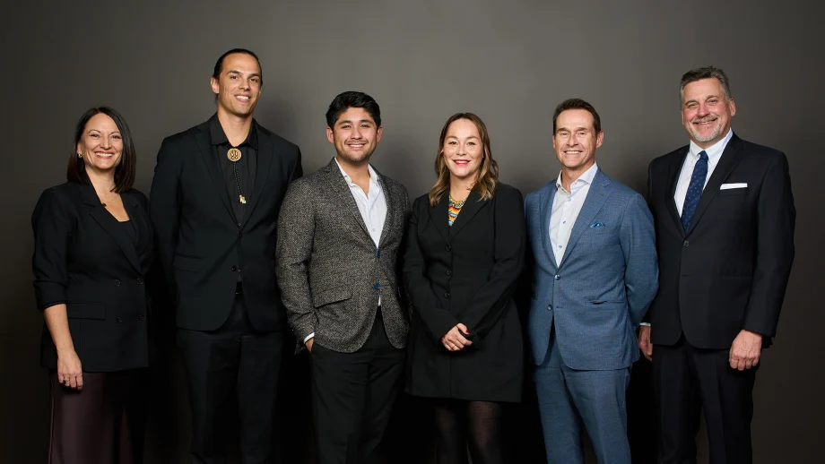 group of people posing in a row