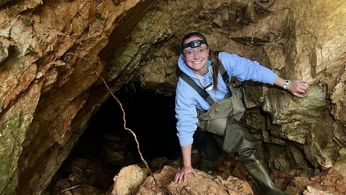 student inside a cave