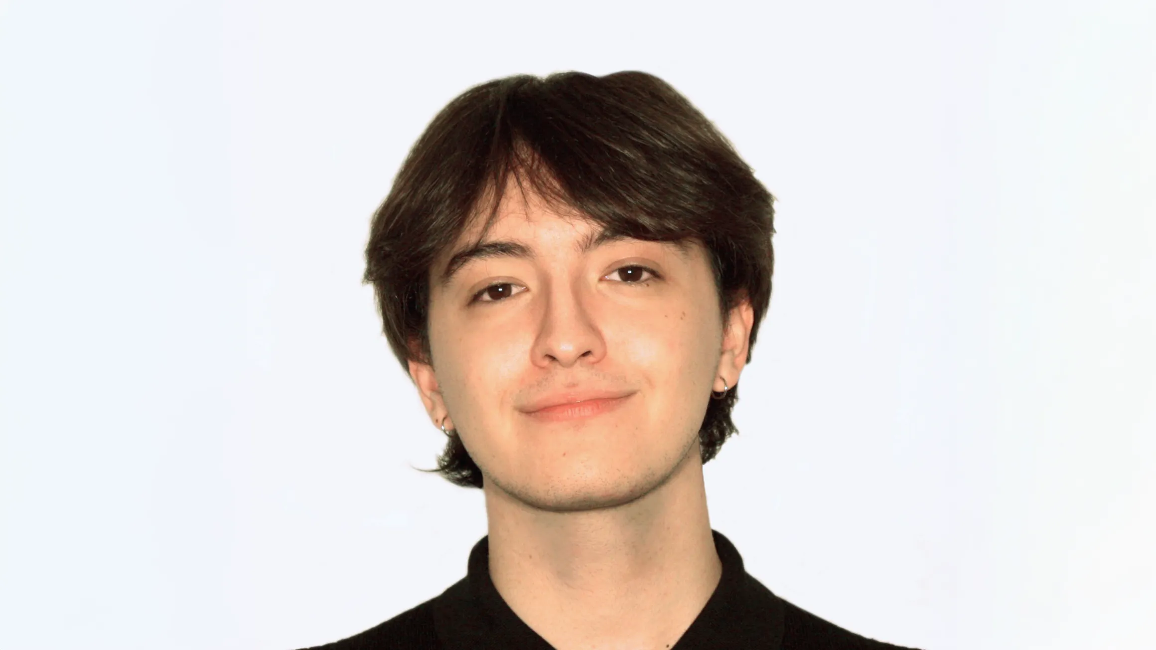 Headshot of Caleb White with a grey background