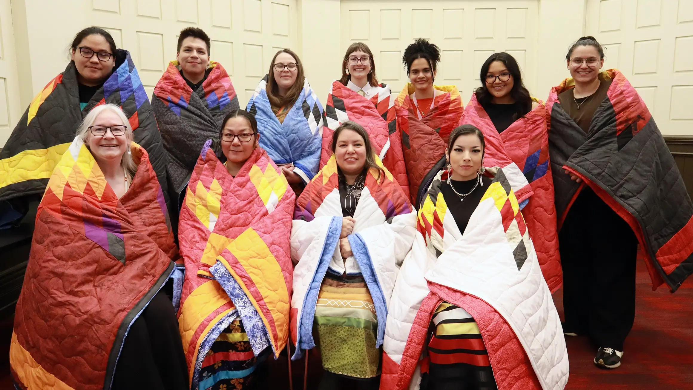 Group of people wrapped in blankets