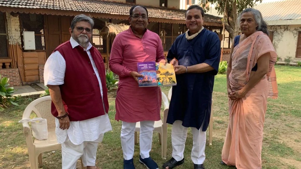 L-R) Dr. Harshad Patel, Vice Chancellor, Dr. Nimisha Shukla, Professor, Rural Economics, Dr. Shailesh Shukla, and Gujarati writer and poet Bhadrayu Vacchrajani pose outdoors.