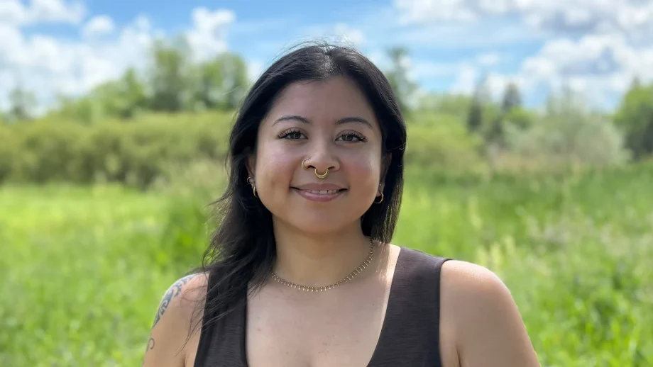 Taylor Wilson with natural background and blue sky.